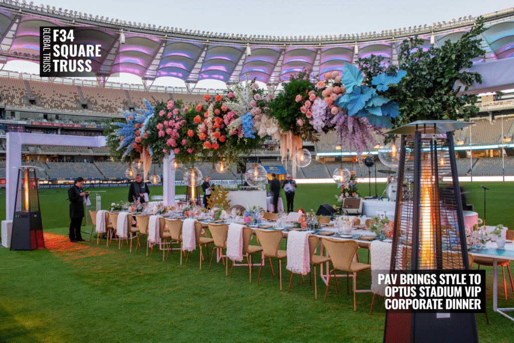 Dining setup and white Lycra-wrapped F34 truss at Optus Stadium VIP corporate dinner.
