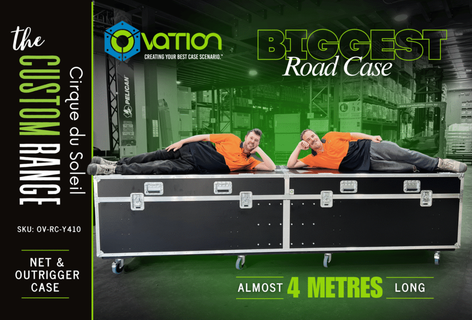 Two Design Quintessence team members lying on an almost 4-metre-long Ovation Custom road case built for Cirque du Soleil.