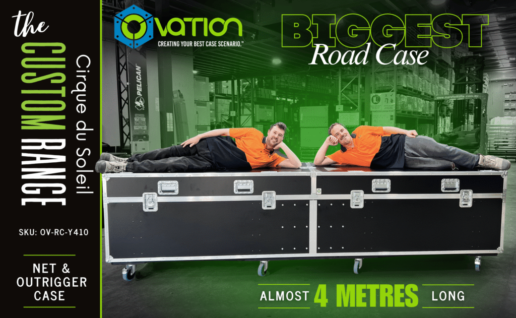 Two Design Quintessence team members lying on an almost 4-metre-long Ovation Custom road case built for Cirque du Soleil.