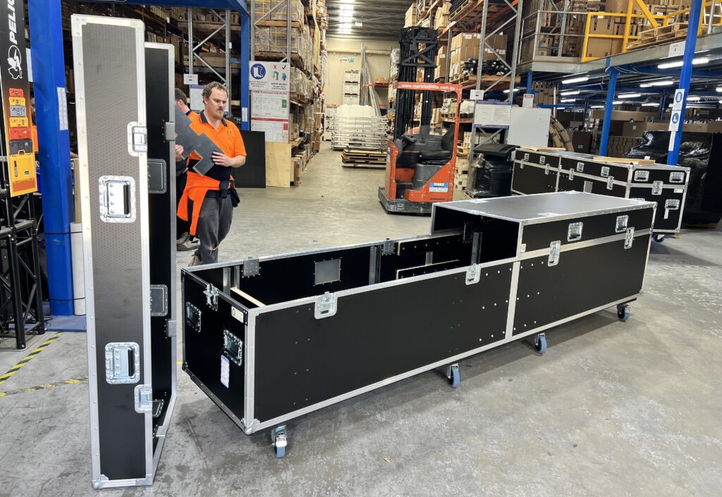 Almost 4-metre-long Ovation Custom road case for Cirque du Soleil, shown open with its large lid and custom internal compartments visible.